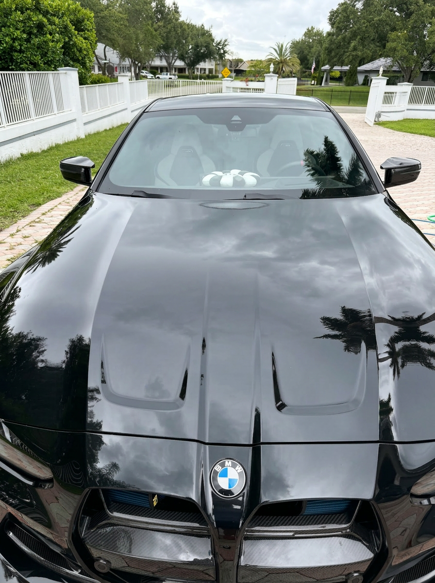 BMW M4 hood and windshield reflection
